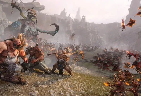 Warhammer 3 capture, a clash between chaos warriors and ogres.